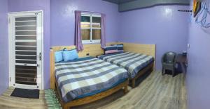 A bed or beds in a room at Ye Yin No84