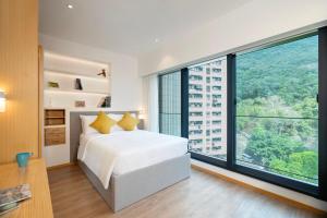 Katil atau katil-katil dalam bilik di Shama Hub Metro South Hong Kong