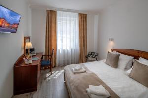 Postel nebo postele na pokoji v ubytování Fonte Hotel