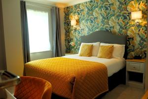 a hotel room with a bed and a window at Ardboyne Hotel in Navan