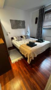 a bedroom with a large bed in a room at Apartament Willa Woda in Jurata