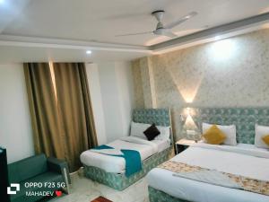 Postel nebo postele na pokoji v ubytování Hotel Hayat Inn
