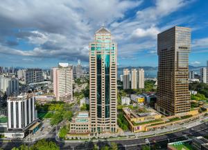 an aerial view of a city with tall buildings at Layflat Hotel in Shenzhen
