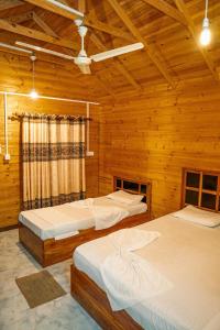 Postel nebo postele na pokoji v ubytování Mithra Paradise Beach Hotel