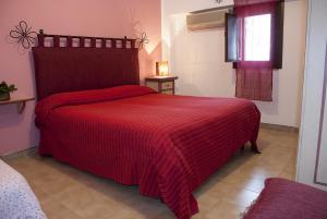 Katil atau katil-katil dalam bilik di Bed And Breakfast Maria
