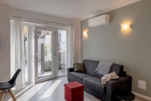 a living room with a couch and a chair at Casa Quadrifoglio - Spalavera in Intra