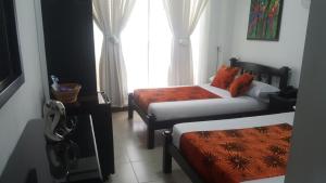 Voodi või voodid majutusasutuse Hotel Colonial toas