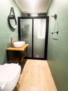 a bathroom with a toilet and a sink at The Villa - Lascari Cefalu' in Lascari