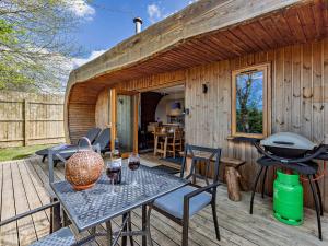 a patio with a table and chairs and a grill at 2 Bed in Westward Ho 41130 in Westward Ho