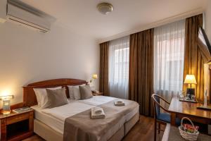 Postel nebo postele na pokoji v ubytování Fonte Hotel