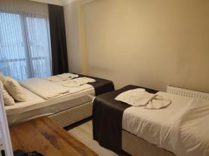 Ένα ή περισσότερα κρεβάτια σε δωμάτιο στο Ruşen otel +7 φωτογραφίες