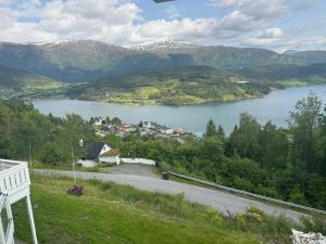 a view of a lake with mountains in the background at Nylendo in Ulvik