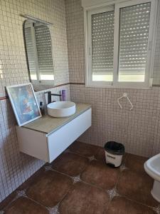 a bathroom with a sink and a mirror at Miradol del Sol in La Nucía +15 photos