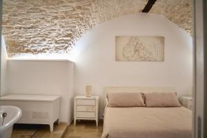 En eller flere senge i et værelse på La Casa di Mary