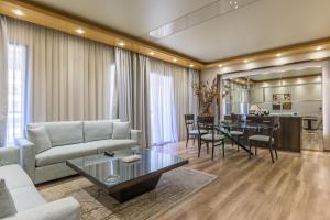 a living room with a couch and a table at Lahoya Verdun in Beirut