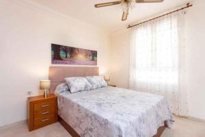 a bedroom with a bed and a ceiling fan at Apartment in Palm Mar - Insel Teneriffa 53099 in Palm-mar +18 photos