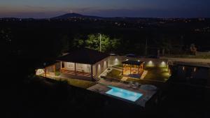 an aerial view of a house with a swimming pool at Avalska Bajka in Ripanj