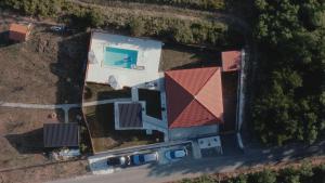 an aerial view of a house with a swimming pool at Avalska Bajka in Ripanj