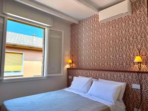 a bedroom with a bed and a window at Country Rooms Medicina B&B - Free Breakfast - Air Conditioning - WiFi in Medicina