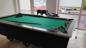 a pool table with balls on it in a room at pensjonat Alka in Jastarnia
