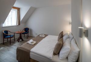 Postel nebo postele na pokoji v ubytování Fonte Hotel + 35 fotografií