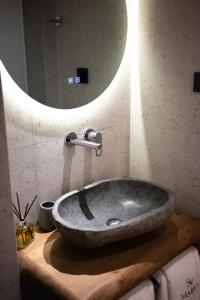 a sink in a bathroom with a large mirror at Be Modern Aparts & Studios in Limenaria +75 photos