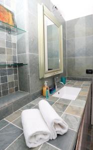 a bathroom with a sink and a mirror and a shower at Sunshine Apartment in Florence in Sesto Fiorentino +28 photos