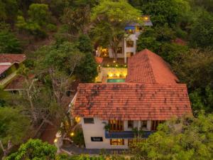 an aerial view of a house with a roof at The Hosteller Bam Goa, Saligao - Poshtel in Calangute +12 photos