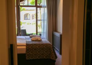 Letto o letti in una camera di Schlosshotel Kitzbühel A-ROSA Collection