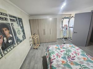 a hospital room with a bed and a poster of a man at Casa Magica in Pozzo +7 photos