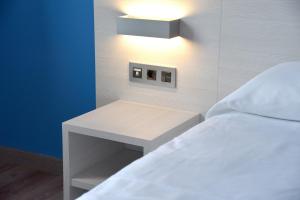 Postel nebo postele na pokoji v ubytování Hotel Julimar