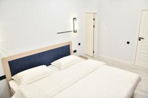 Postel nebo postele na pokoji v ubytování QUT Hotel