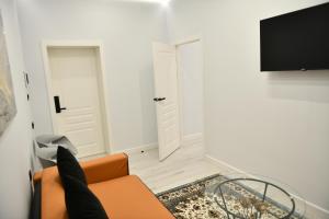 TV a/nebo společenská místnost v ubytování QUT Hotel