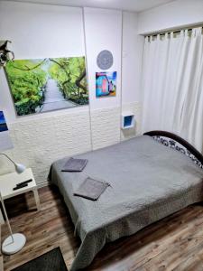 A bed or beds in a room at Centro Apartman