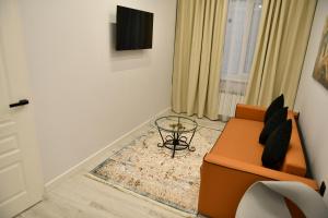 TV a/nebo společenská místnost v ubytování QUT Hotel