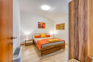 Postel nebo postele na pokoji v ubytování Grad Inn Apartments & Resort