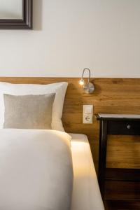Posteľ alebo postele v izbe v ubytovaní Hotel Standlhof Zillertal