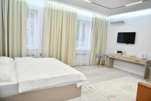 TV a/nebo společenská místnost v ubytování QUT Hotel