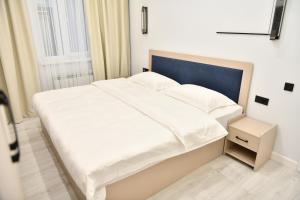 Postel nebo postele na pokoji v ubytování QUT Hotel