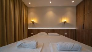 Uma cama ou camas num quarto em Apartments Stanaj