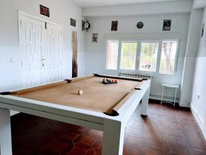 a billiard table in a room with at Casa Cadalso, Mirador de Gredos, Madrid in Cadalso de los Vidrios