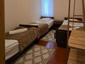 Postel nebo postele na pokoji v ubytování Ailama Guesthouse
