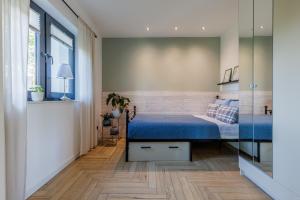 Ein Bett oder Betten in einem Zimmer der Unterkunft Solo na wyspie, blisko morza Sobieszewo
