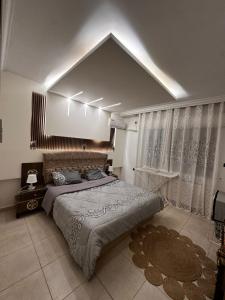 Ένα ή περισσότερα κρεβάτια σε δωμάτιο στο Kayla Apartment