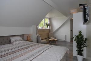 Postel nebo postele na pokoji v ubytování B&B De Kaagse Boer