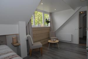 Postel nebo postele na pokoji v ubytování B&B De Kaagse Boer