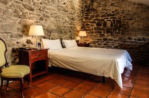 Cama o camas de una habitación en Hotel Rural Nobles de Navarra