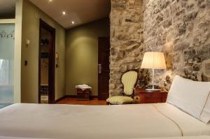 Cama o camas de una habitación en Hotel Rural Nobles de Navarra