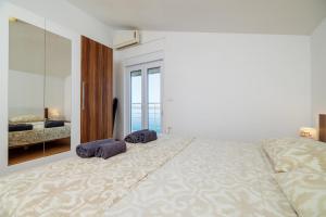 Postel nebo postele na pokoji v ubytování Apartment Toma