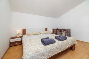 Postel nebo postele na pokoji v ubytování Apartment Toma